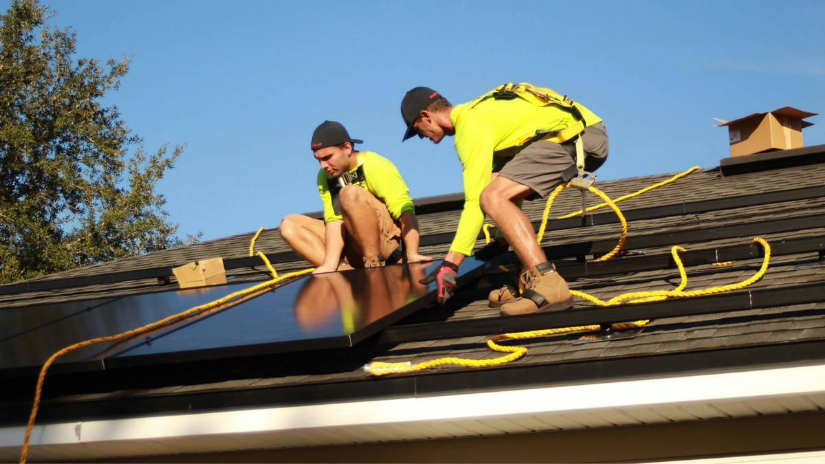 Close-up of a cracked solar panel being inspected by a technician – can a solar panel be repaired