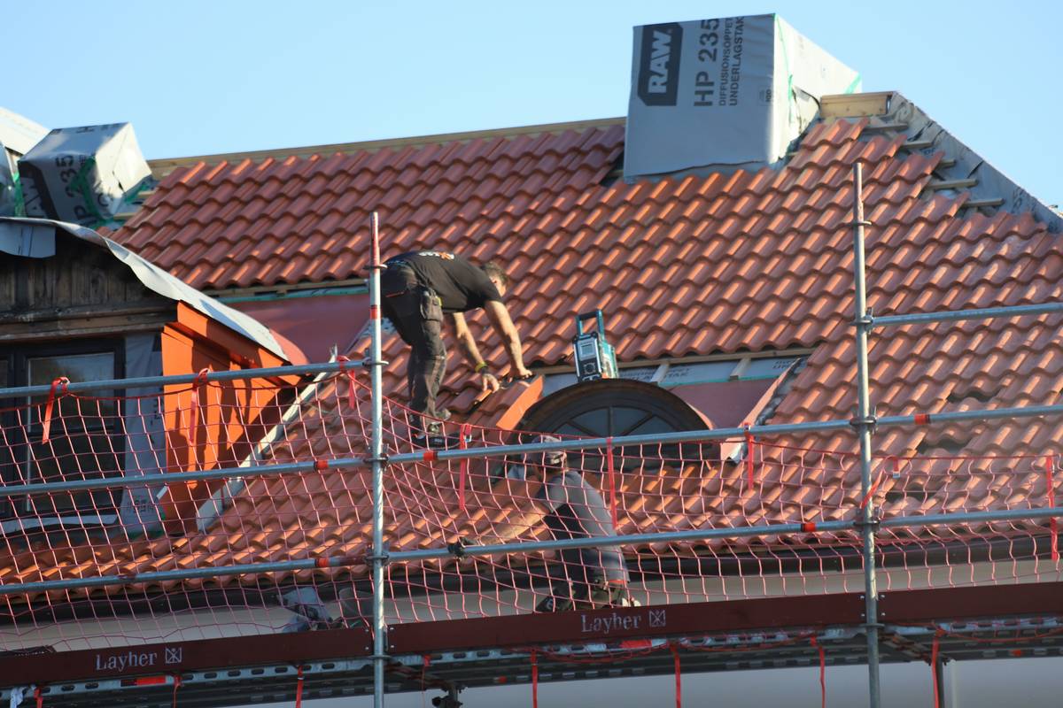 solar panels and roof repair showing mounted panels with integrated flashing on asphalt shingles